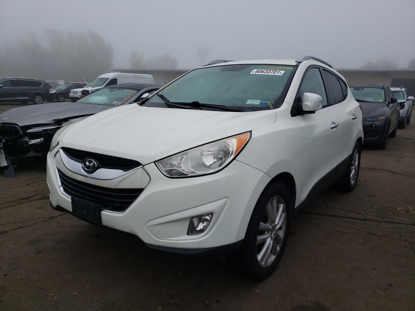 Photo 2 from auction – 2011 HYUNDAI TUCSON with VIN KM8JUCAC0AU023044