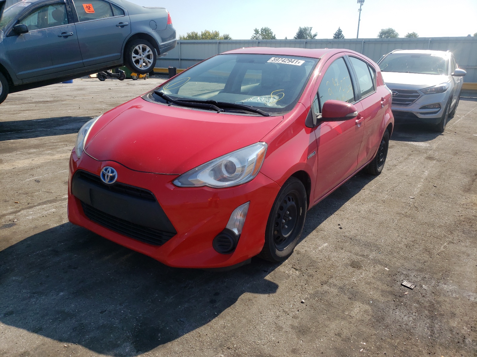 Photo 2 from auction – 2015 TOYOTA PRIUS C with VIN JTDKDTB35F1586056