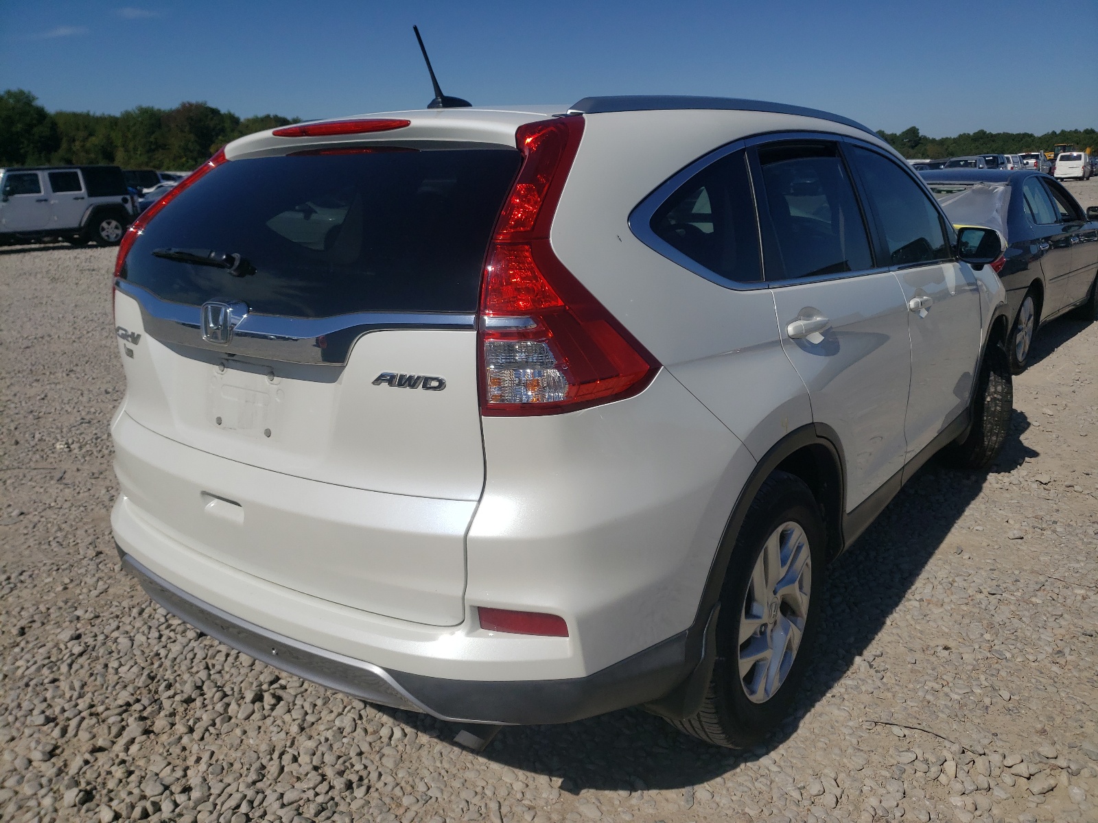 Photo 4 from auction – 2015 HONDA CR-V EXL with VIN 5J6RM4H7XFL028281