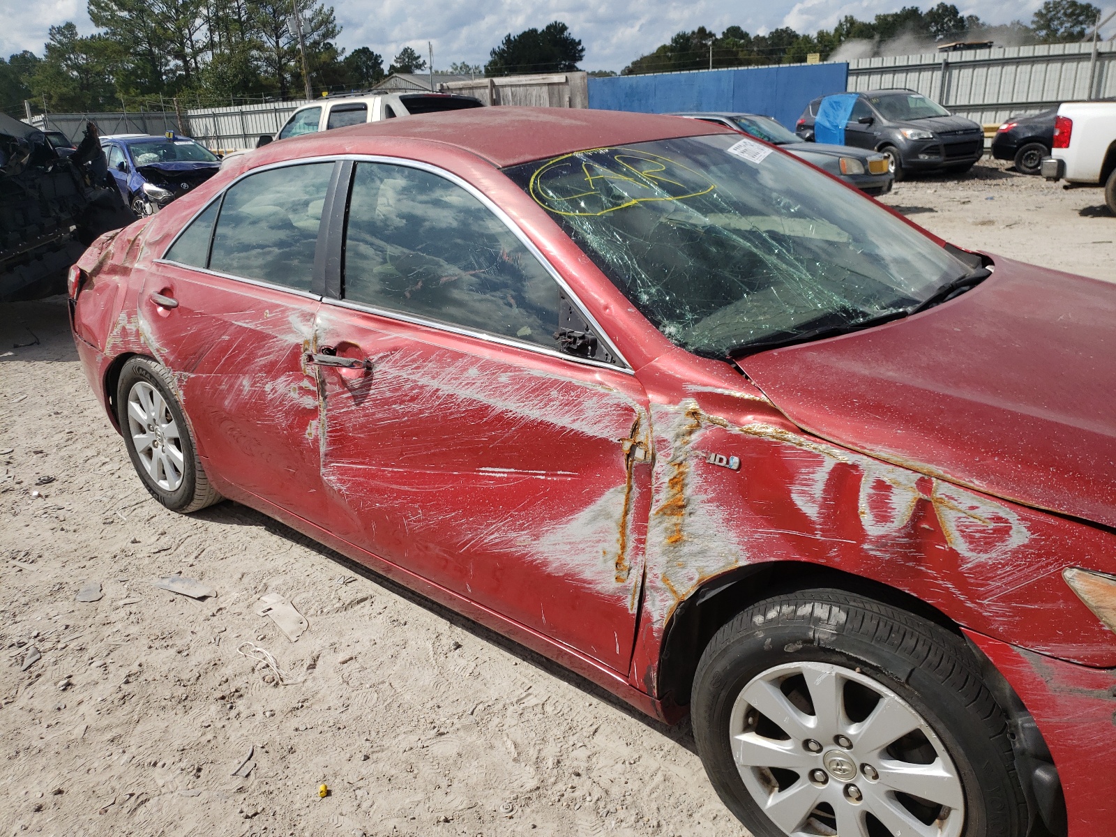 Photo 9 from auction – 2007 TOYOTA CAMRY HYBR with VIN JTNBB46K773029227