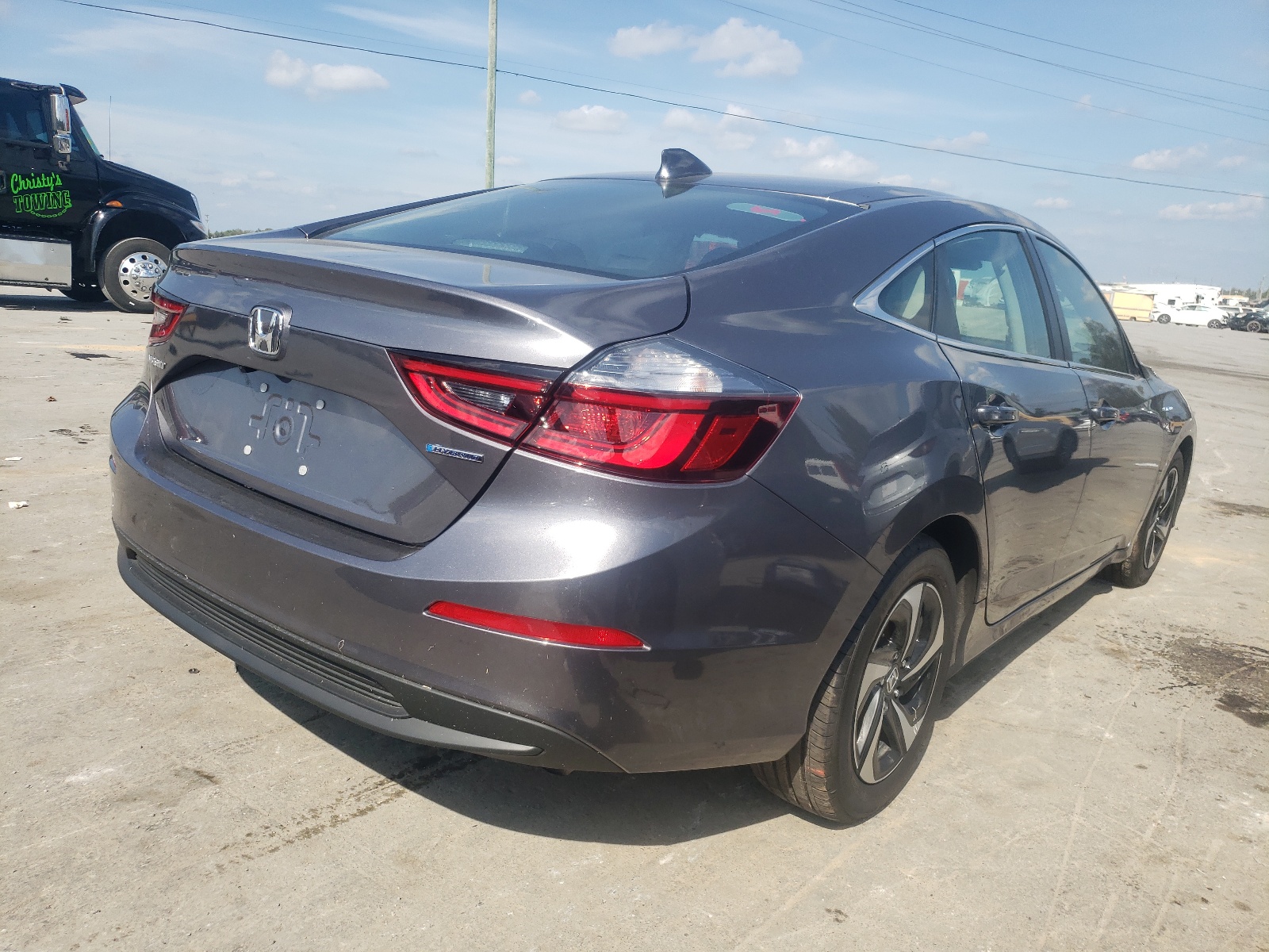 Photo 4 from auction – 2021 HONDA INSIGHT EX with VIN 19XZE4F50ME010558