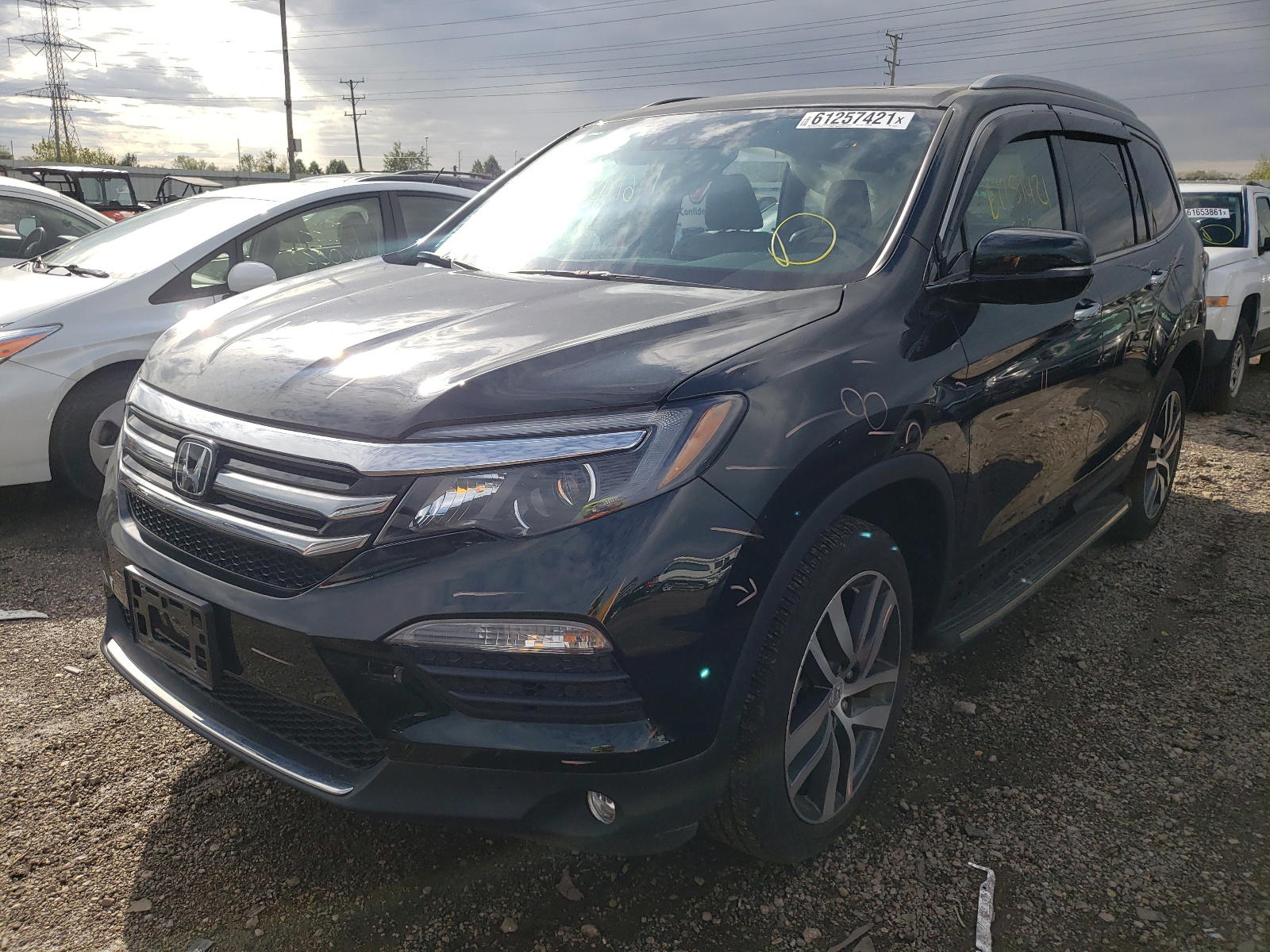 Photo 2 from auction – 2017 HONDA PILOT ELIT with VIN 5FNYF6H09HB101155