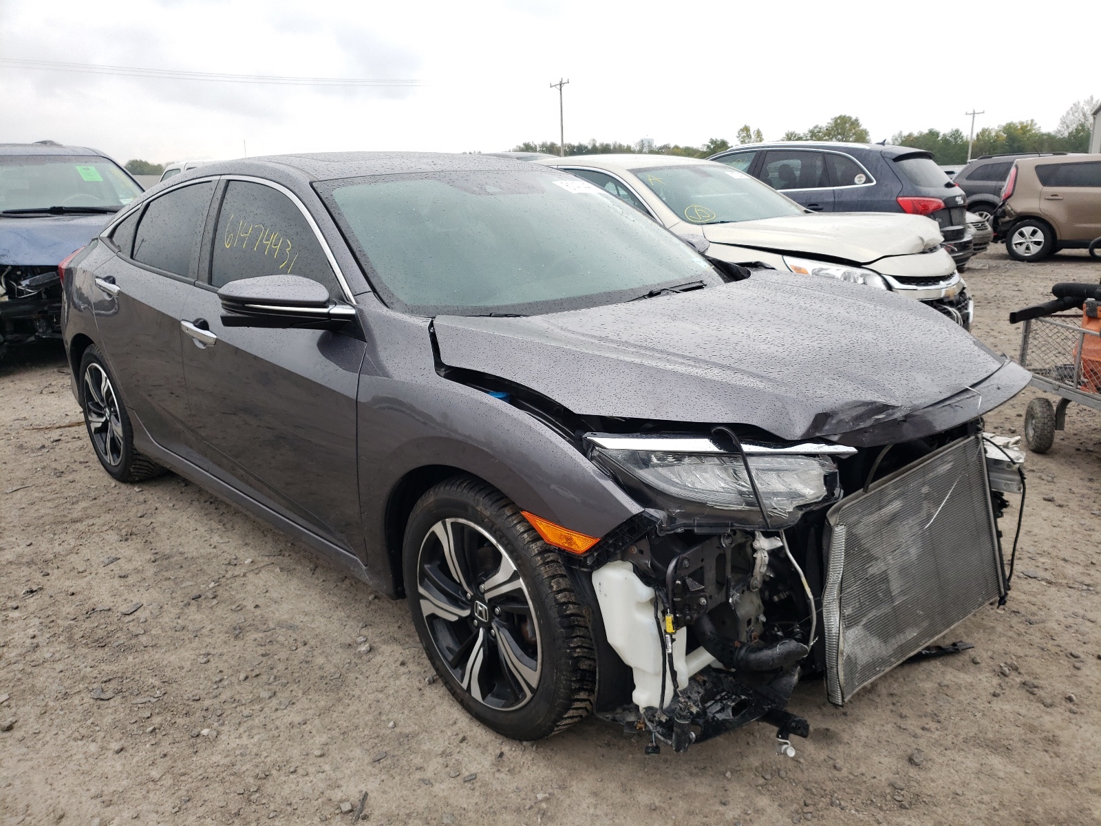 HONDA CIVIC TOUR 2016 with VIN 19XFC1F92GE210467 - Photo from auction