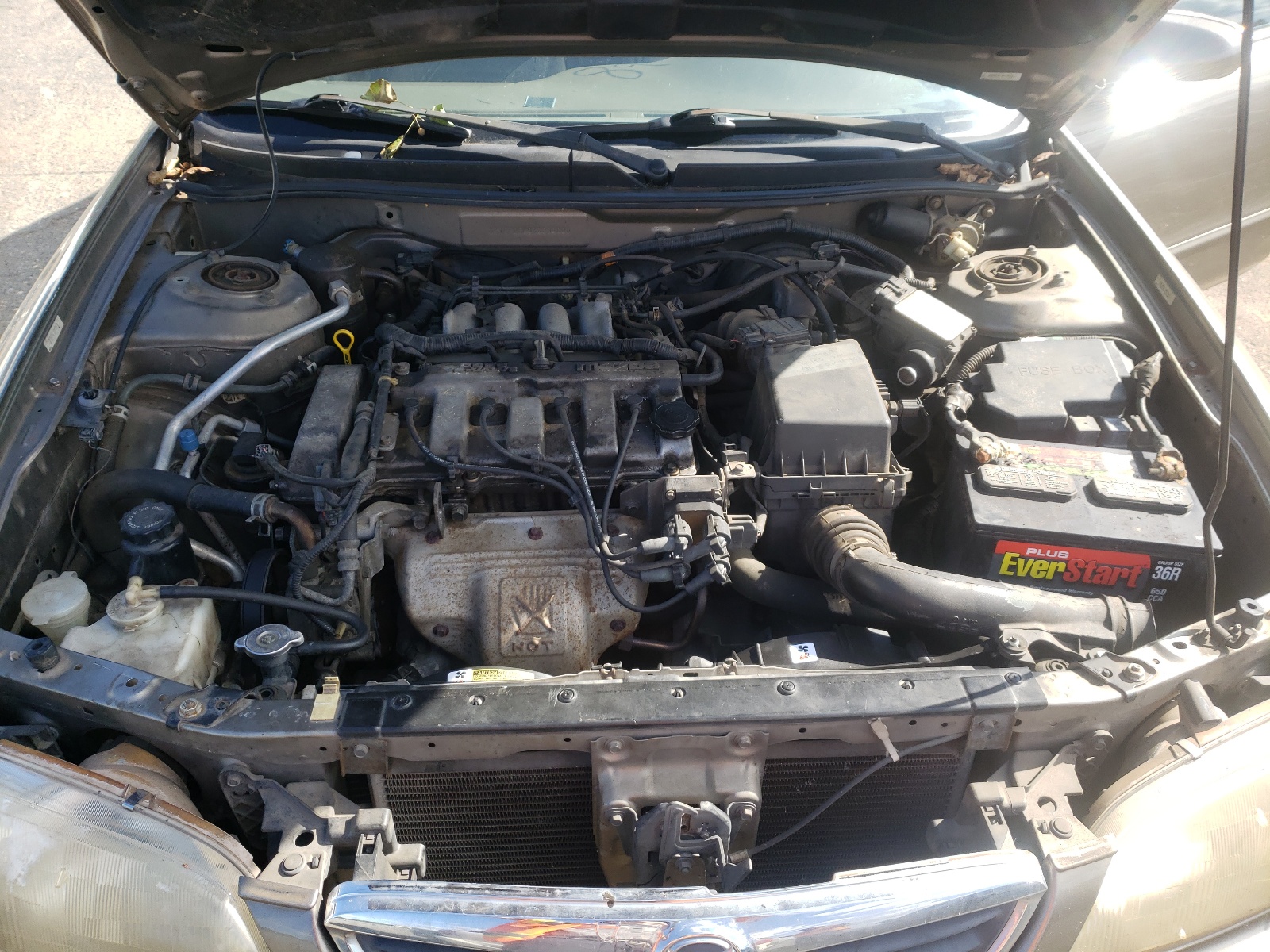 Photo 7 from auction – 1999 MAZDA 626 ES with VIN 1YVGF22C0X5899000