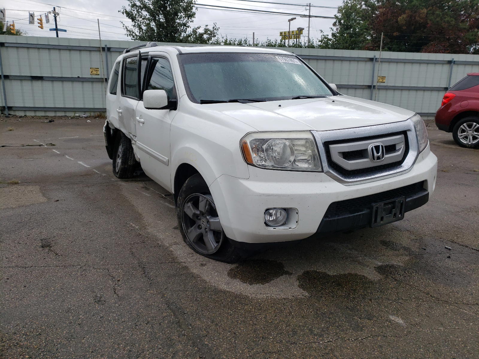 HONDA PILOT EXL 2011 with VIN 5FNYF4H5XBB049929 - Photo from auction
