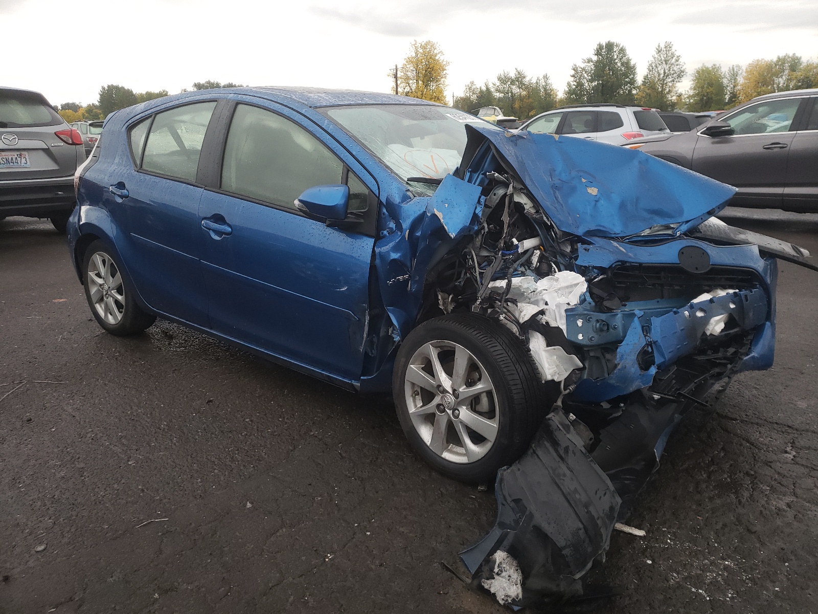 TOYOTA PRIUS C 2015 with VIN JTDKDTB38F1091768 - Photo from auction