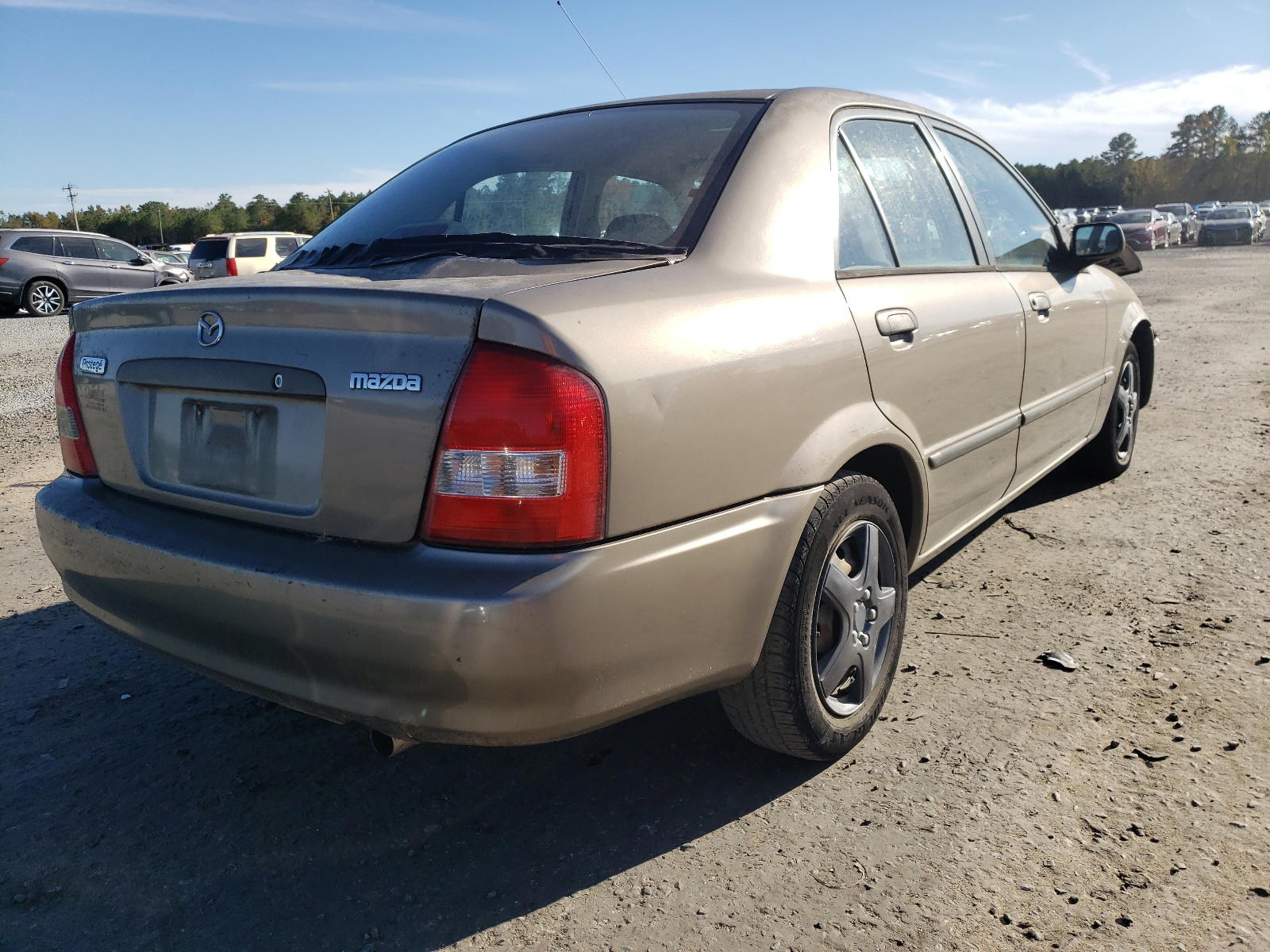 Photo 4 from auction – 2000 MAZDA PROTEGE with VIN JM1BJ2228Y0258228