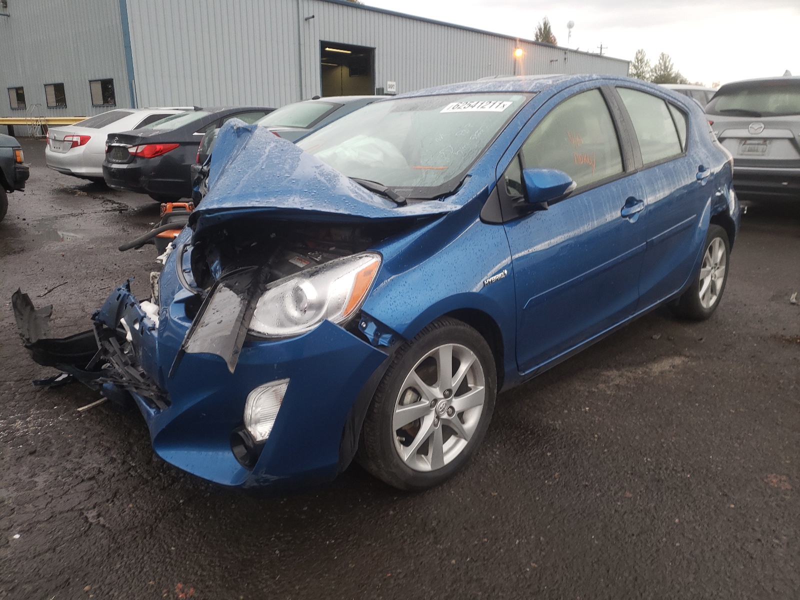 Photo 2 from auction – 2015 TOYOTA PRIUS C with VIN JTDKDTB38F1091768