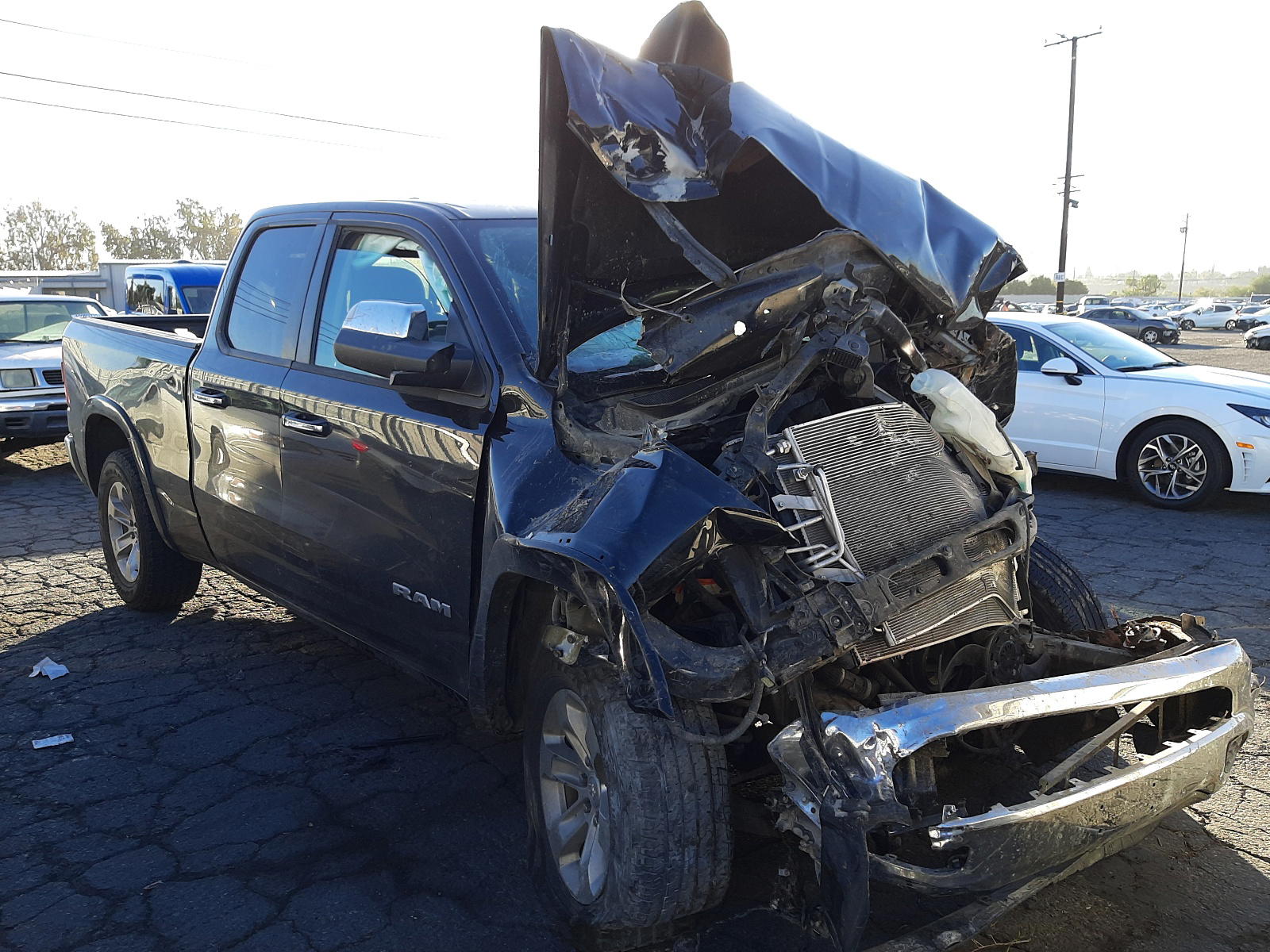RAM 1500 LARAM 2019 with VIN 1C6SRFDT2KN734867 - Photo from auction