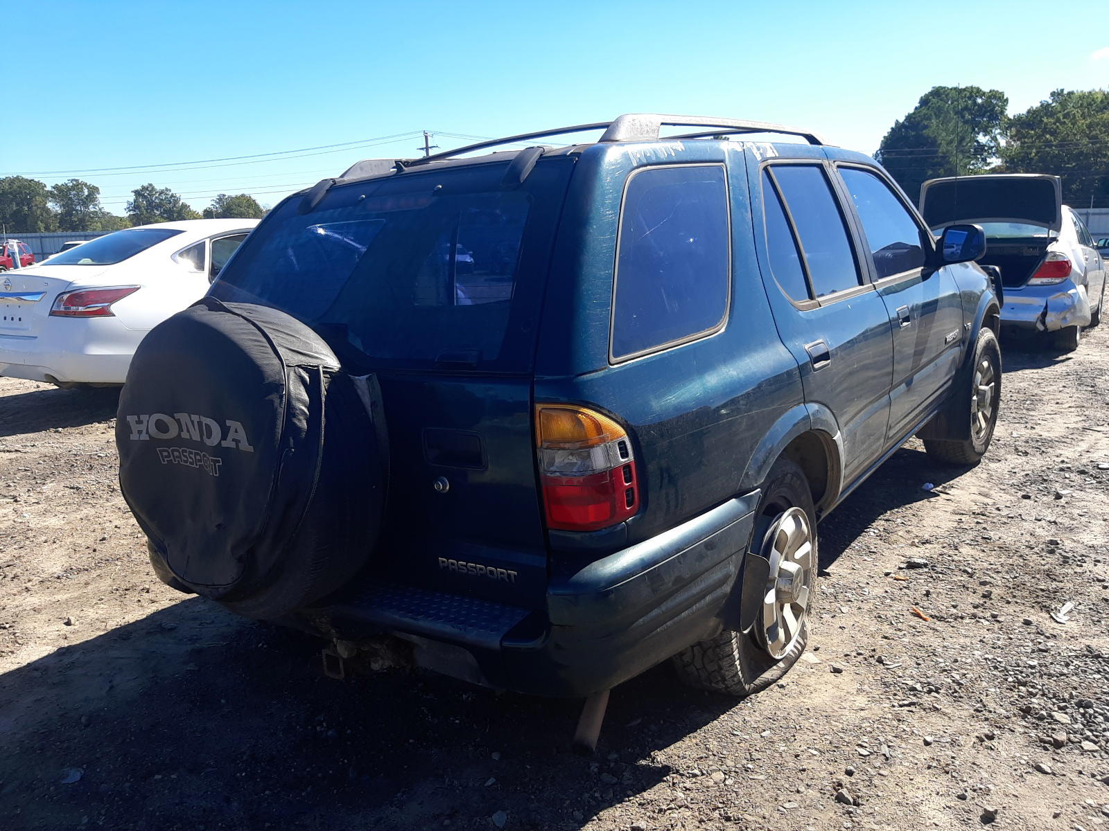 Photo 4 from auction – 2001 HONDA PASSPORT E with VIN 4S6DM58W214408752