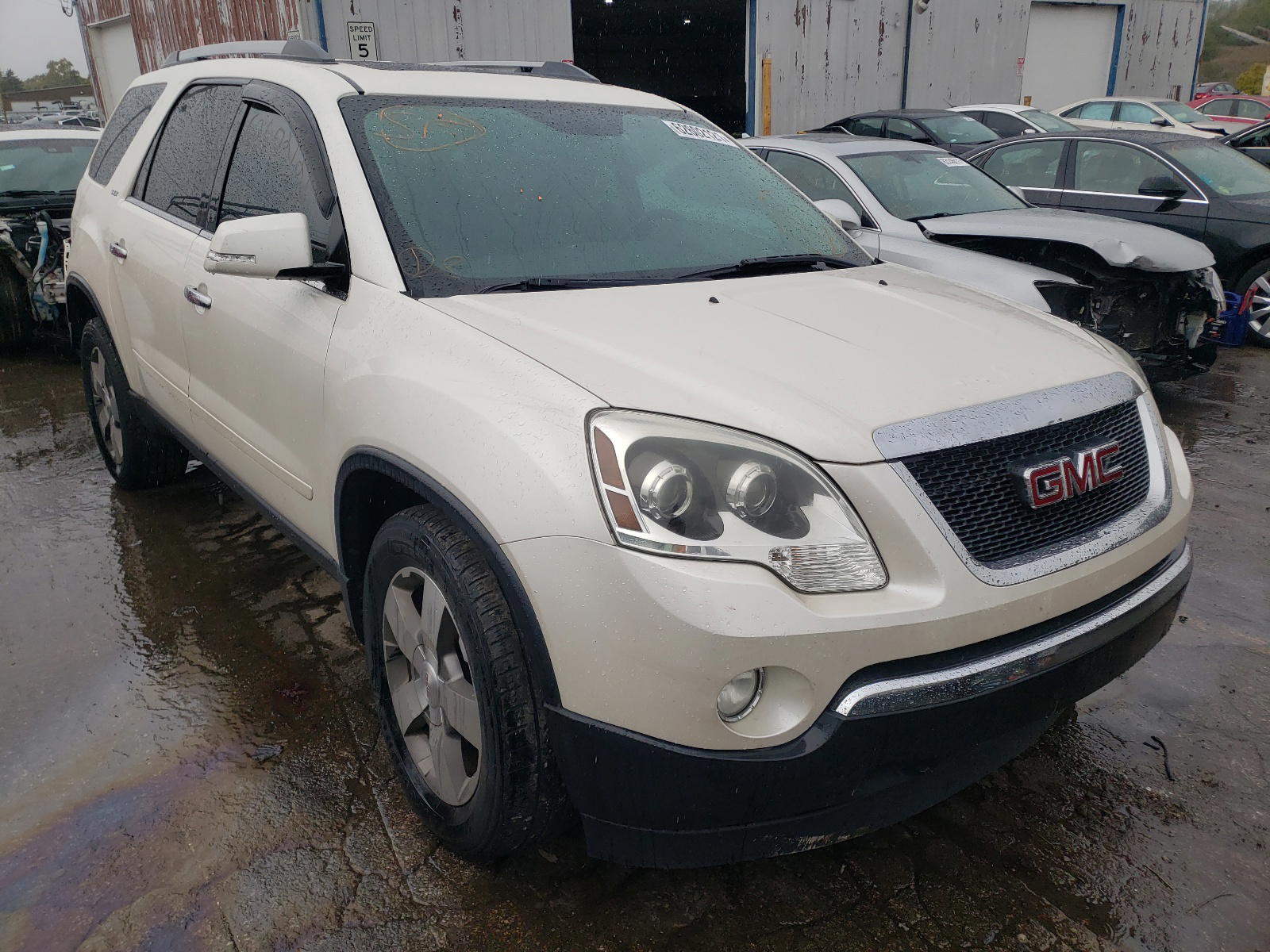 GMC ACADIA SLT 2011 with VIN 1GKKRSED0BJ125670 - Photo from auction