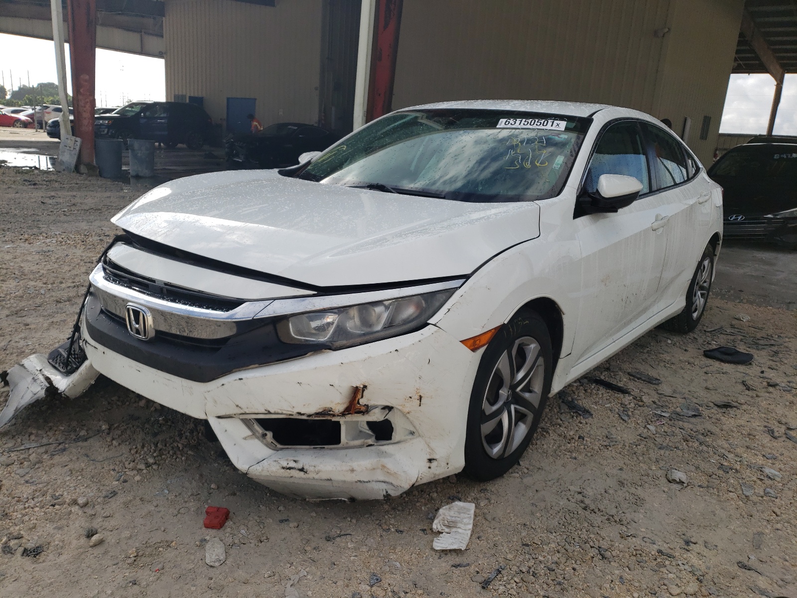 Photo 2 from auction – 2016 HONDA CIVIC LX with VIN 19XFC2F54GE096250
