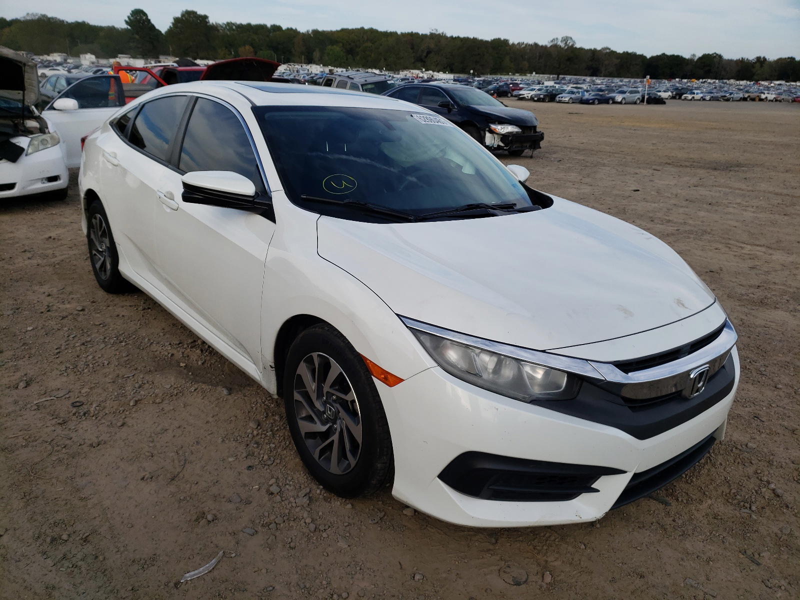HONDA CIVIC EX 2017 with VIN 19XFC2F74HE002256 - Photo from auction