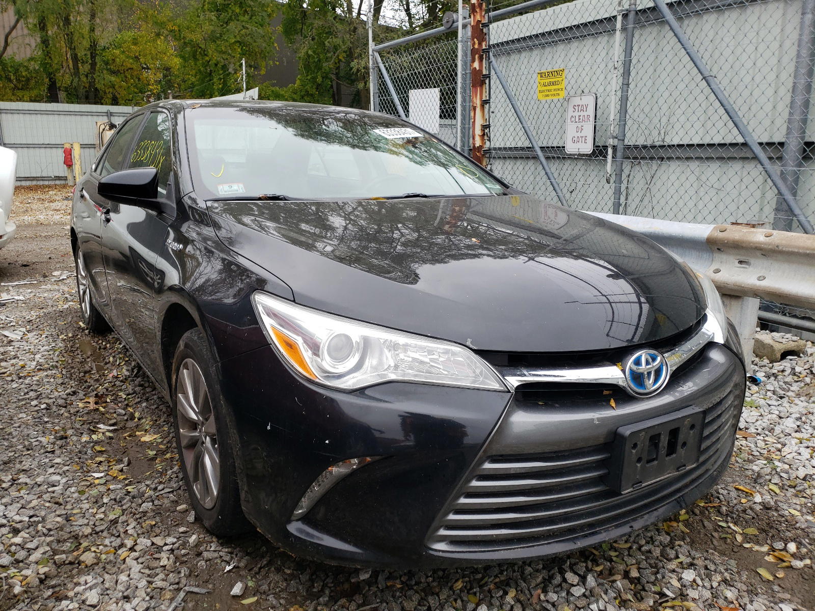 TOYOTA CAMRY HYBR 2015 with VIN 4T1BD1FK0FU166317 - Photo from auction