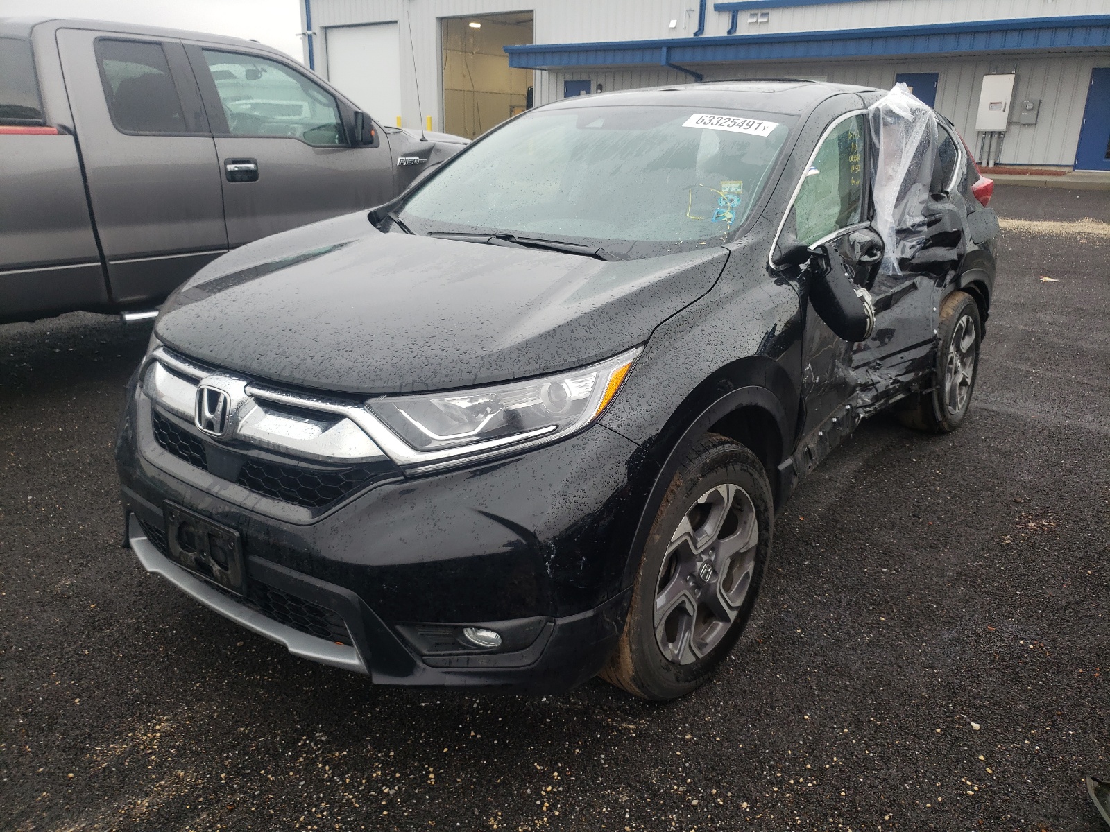 Photo 2 from auction – 2018 HONDA CR-V EXL with VIN 7FARW2H83JE025834
