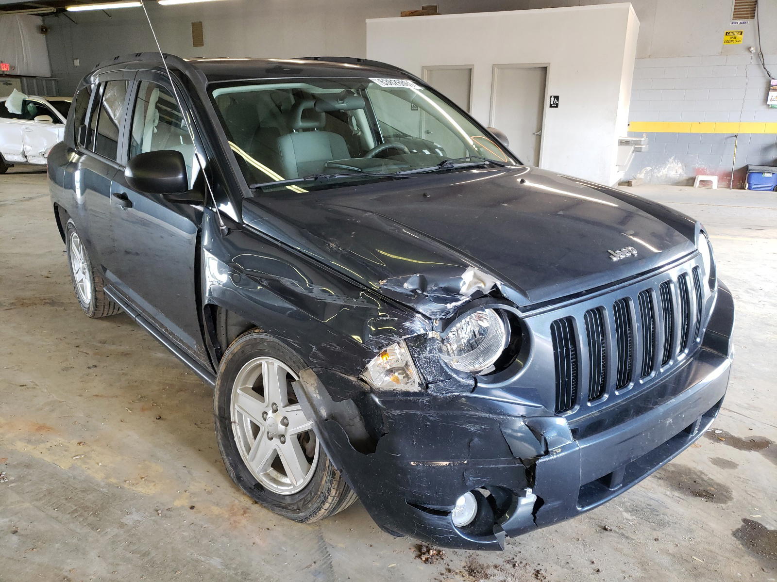 JEEP COMPASS 2007 with VIN 1J8FT47W37D390252 - Photo from auction