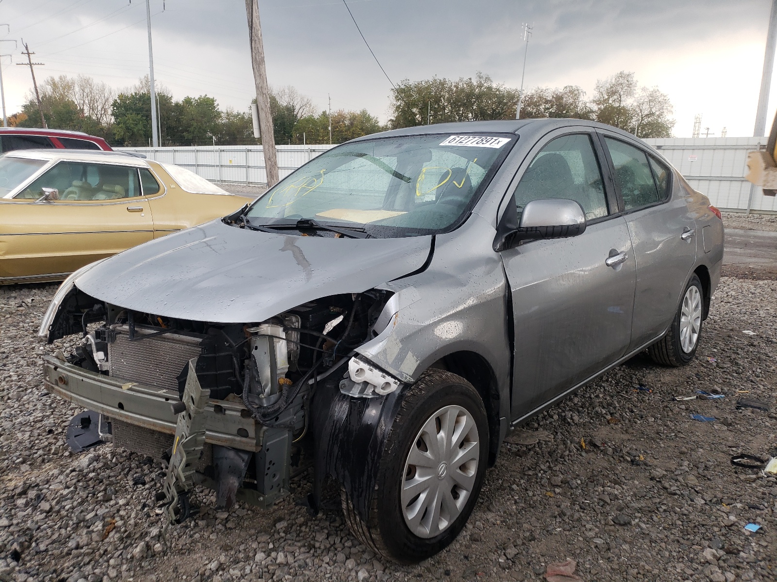 Photo 2 from auction – 2012 NISSAN VERSA S with VIN 3N1CN7AP6CL889450