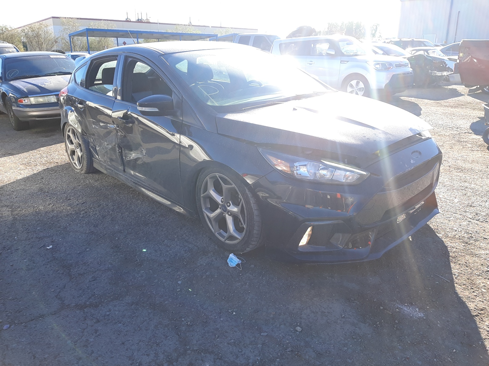 FORD FOCUS ST 2018 with VIN 1FADP3L9XJL332106 - Photo from auction
