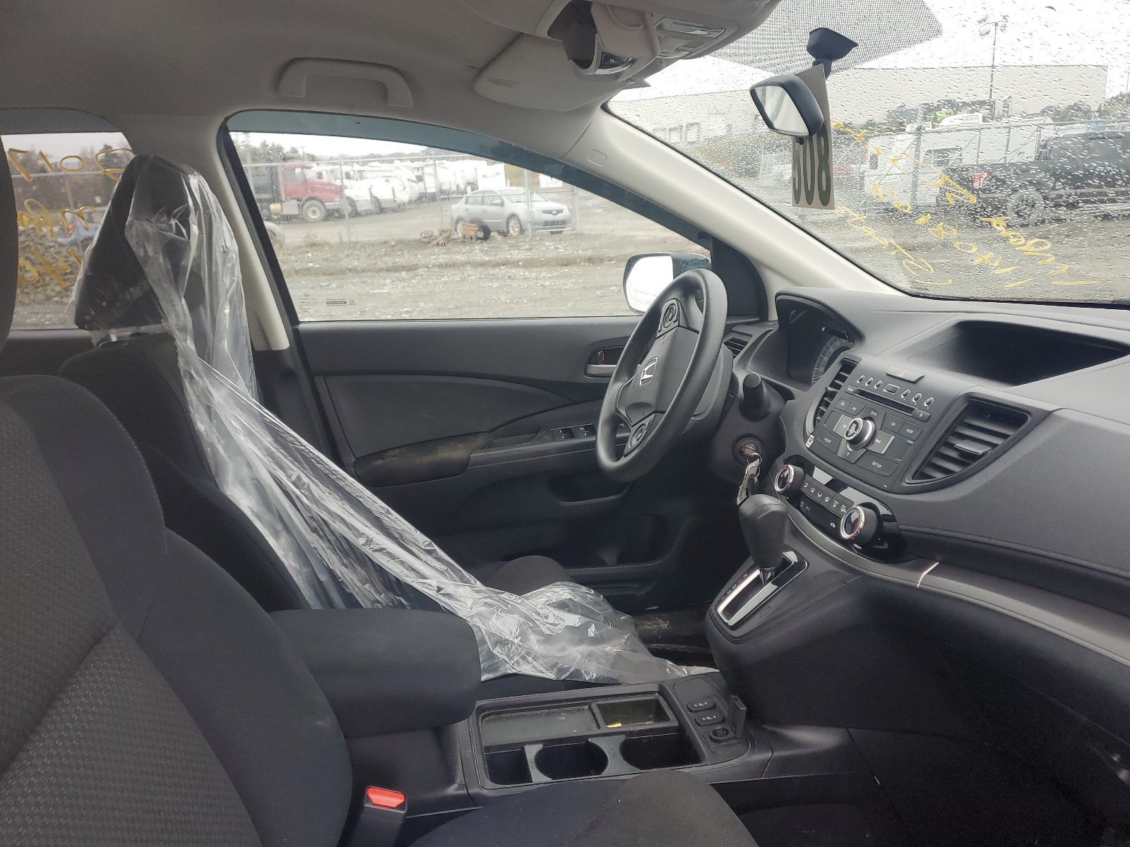 Photo 5 from auction – 2016 HONDA CR-V LX with VIN 2HKRM4H33GH123239