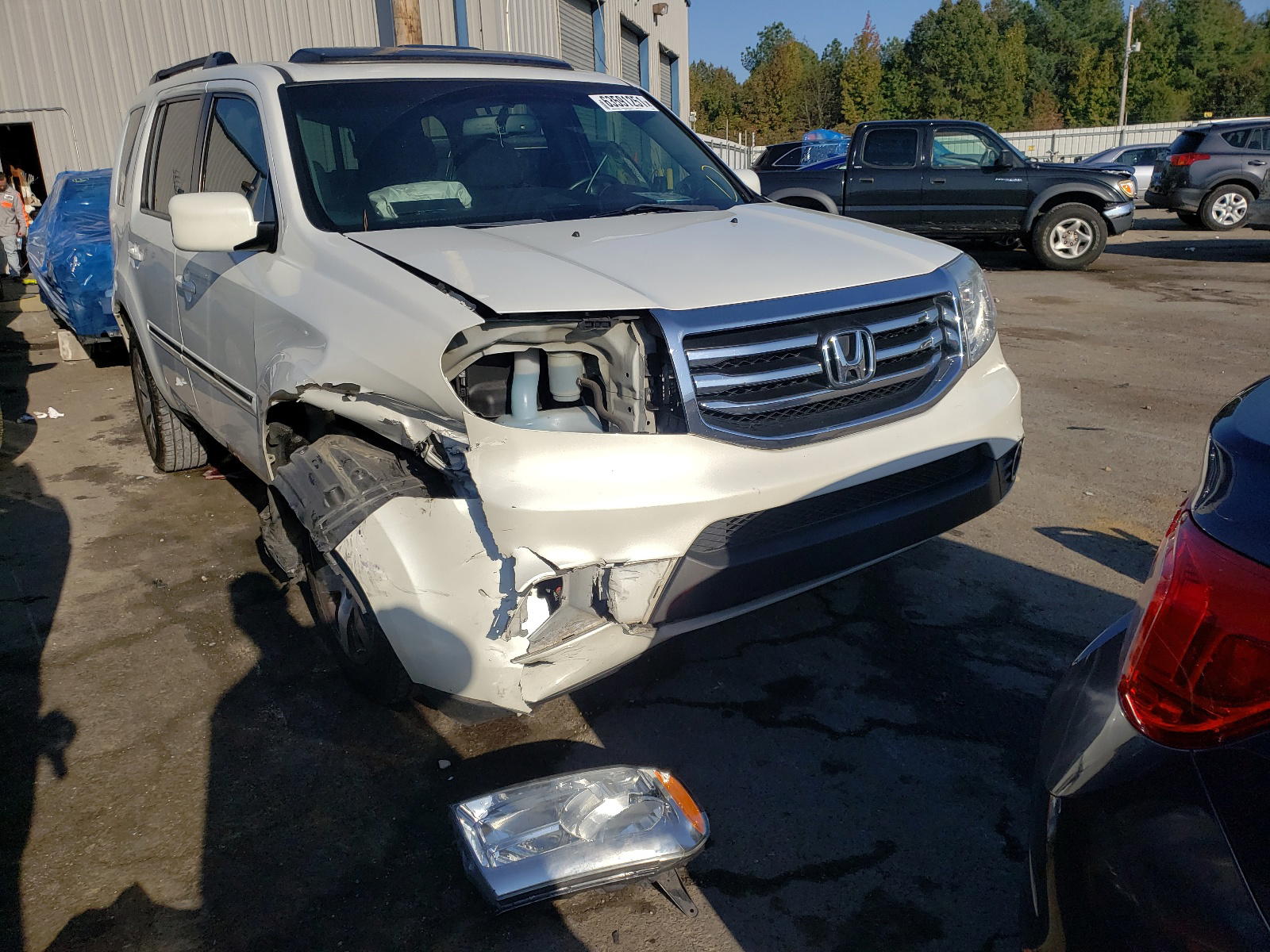 HONDA PILOT TOUR 2012 with VIN 5FNYF3H92CB042911 - Photo from auction