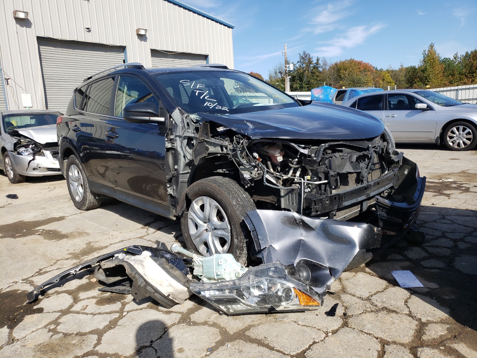 TOYOTA RAV4 LE 2014 with VIN JTMZFREV6ED031252 - Photo from auction