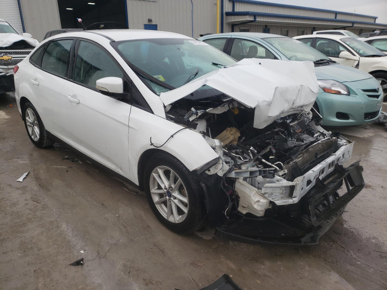 FORD FOCUS SE 2015 with VIN 1FADP3F2XFL210660 - Photo from auction