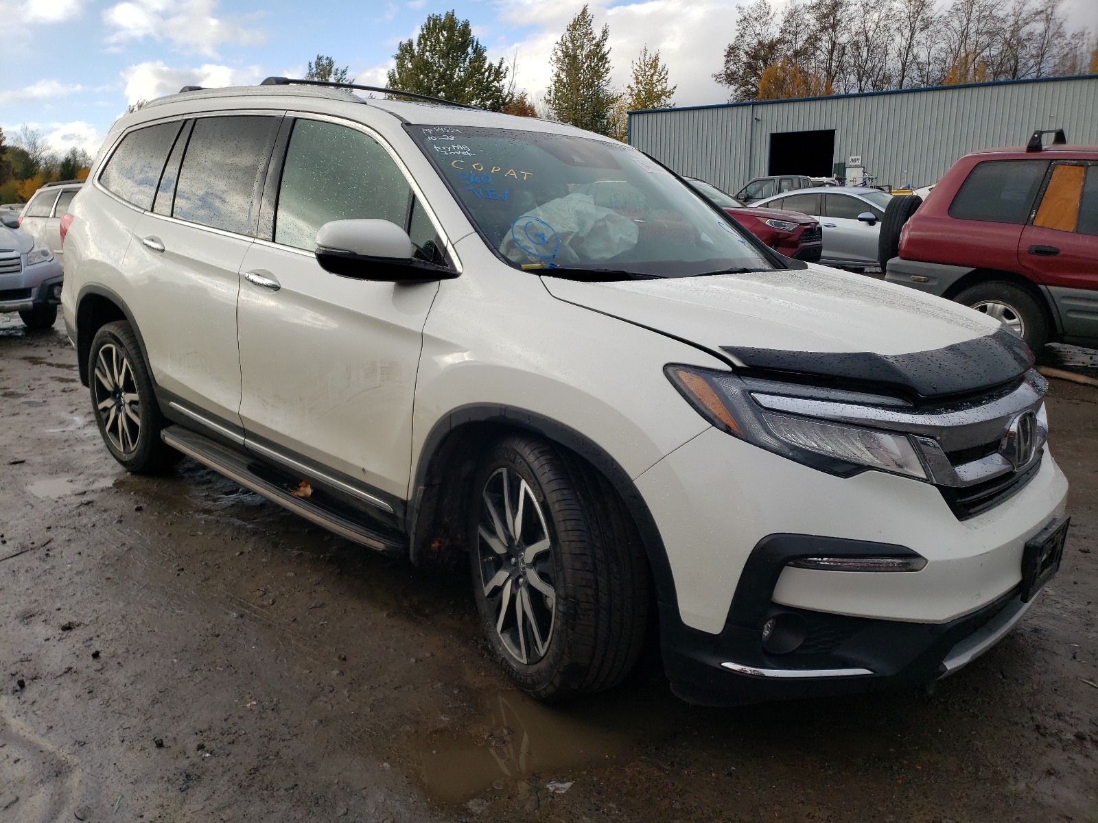 HONDA PILOT TOUR 2019 with VIN 5FNYF6H62KB062226 - Photo from auction