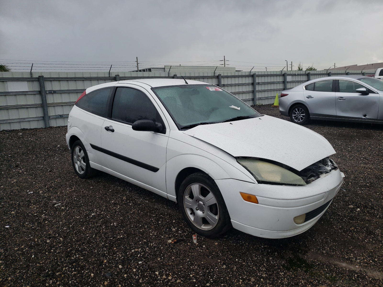 FORD FOCUS LX 2004 with VIN 3FAFP313X4R117807 - Photo from auction