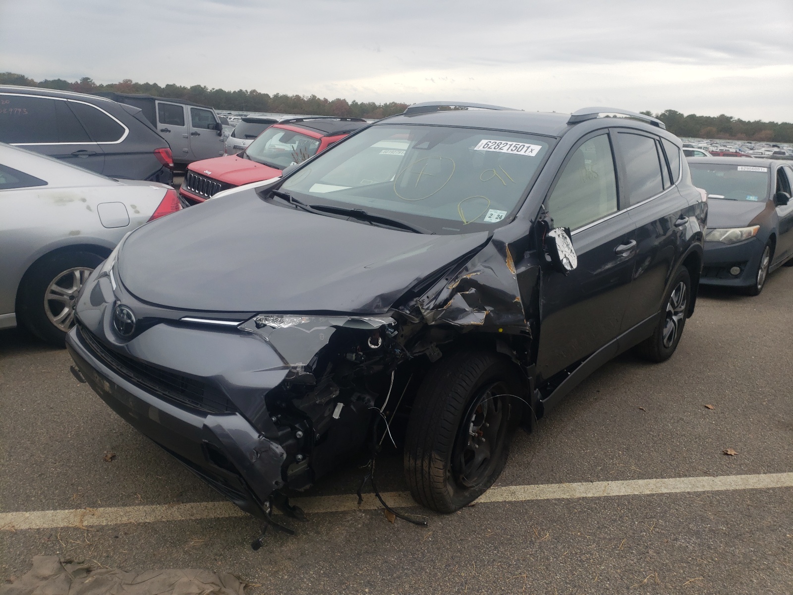 Photo 2 from auction – 2018 TOYOTA RAV4 LE with VIN JTMBFREV3JD248382