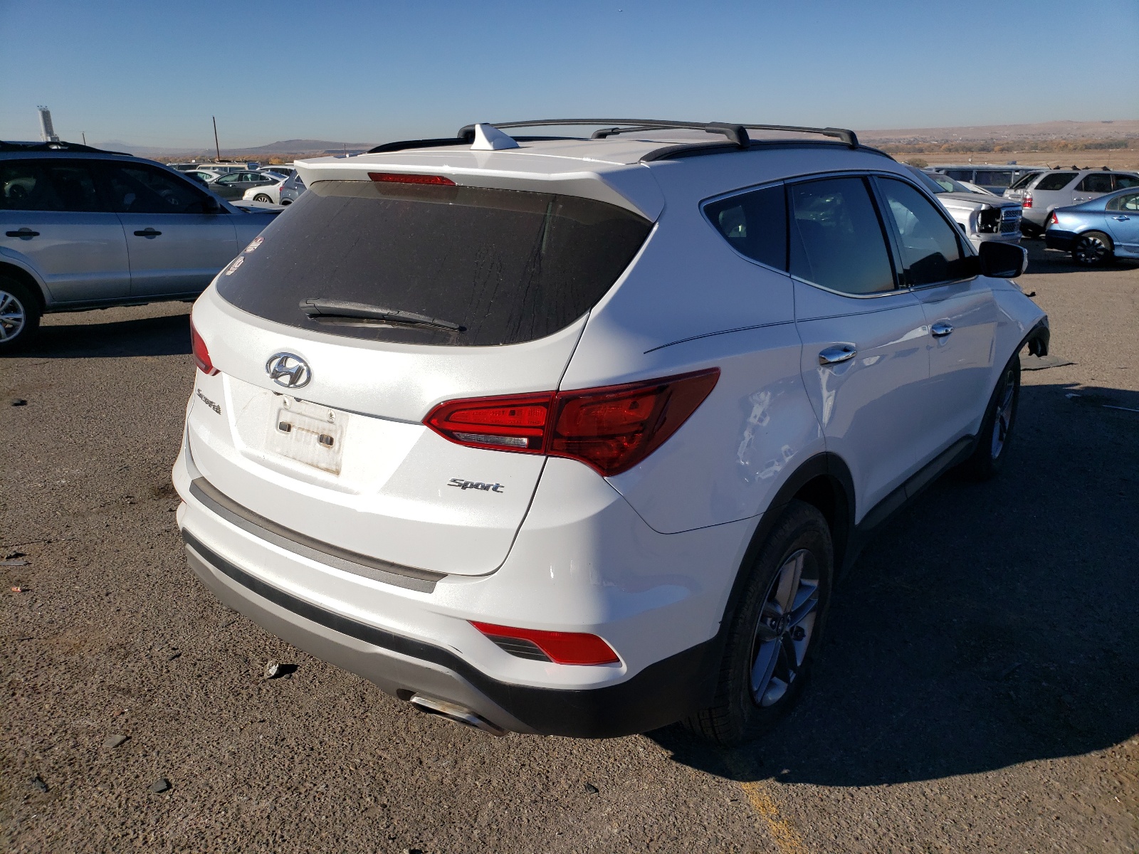 Photo 4 from auction – 2017 HYUNDAI SANTA FE S with VIN 5NMZU3LB1HH042053