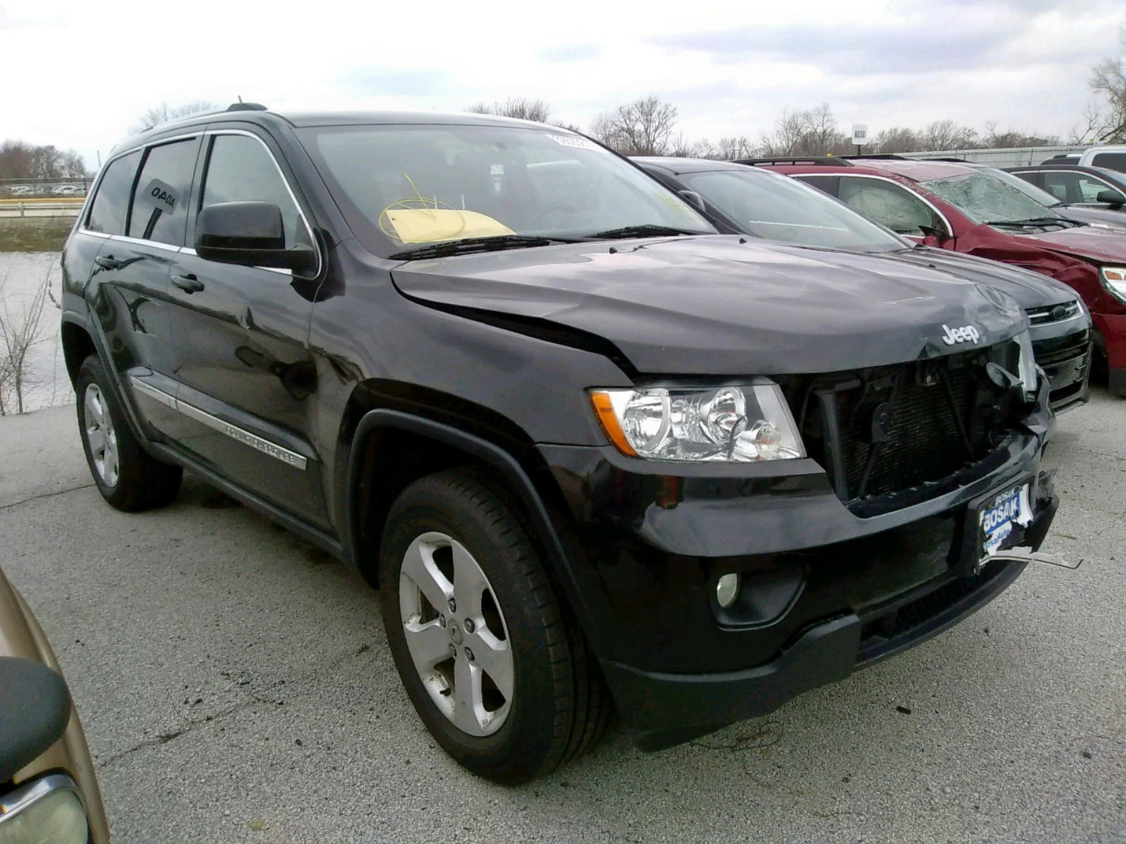 JEEP GRAND CHER 2012 with VIN 1C4RJFAG5CC285302 - Photo from auction