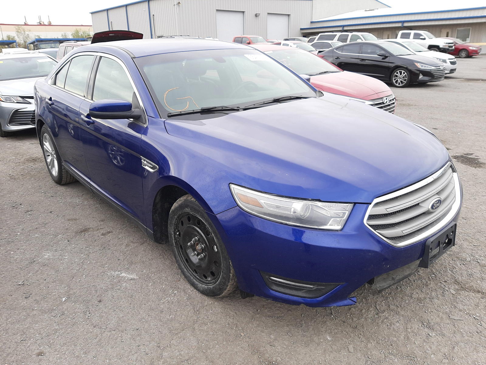 FORD TAURUS SEL 2013 with VIN 1FAHP2E83DG229770 - Photo from auction