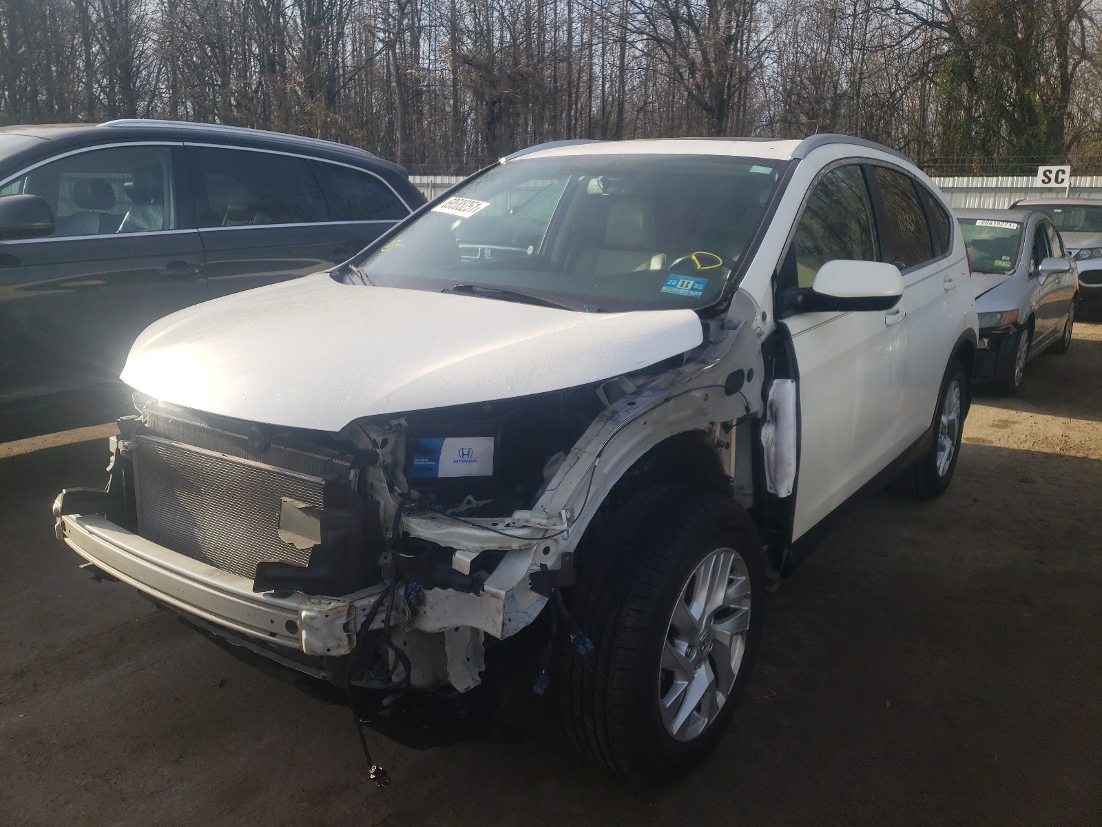 Photo 2 from auction – 2015 HONDA CR-V EXL with VIN 5J6RM4H70FL115249