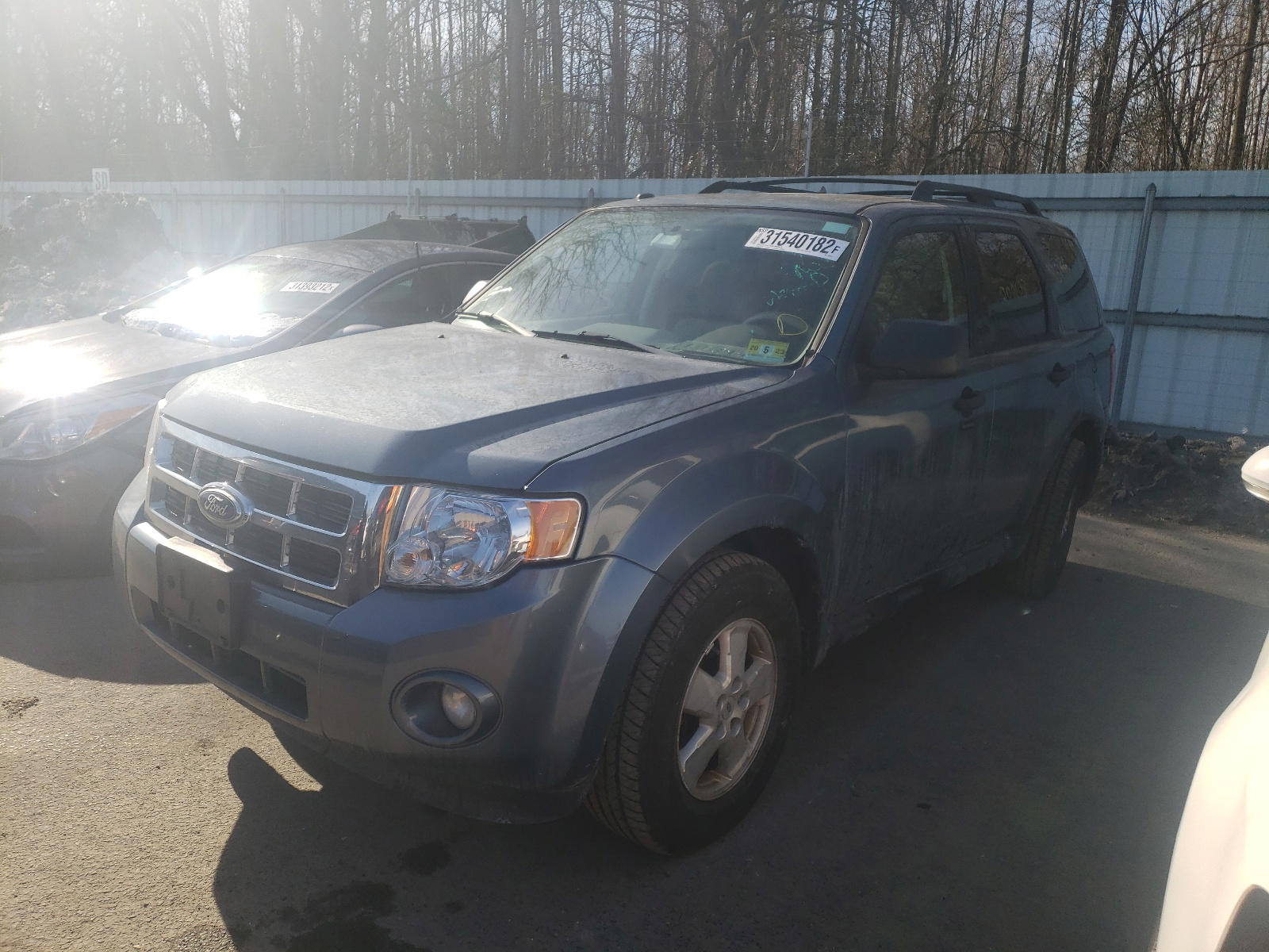 Photo 2 from auction – 2011 FORD ESCAPE with VIN 1FMCU9DG4BKA24673