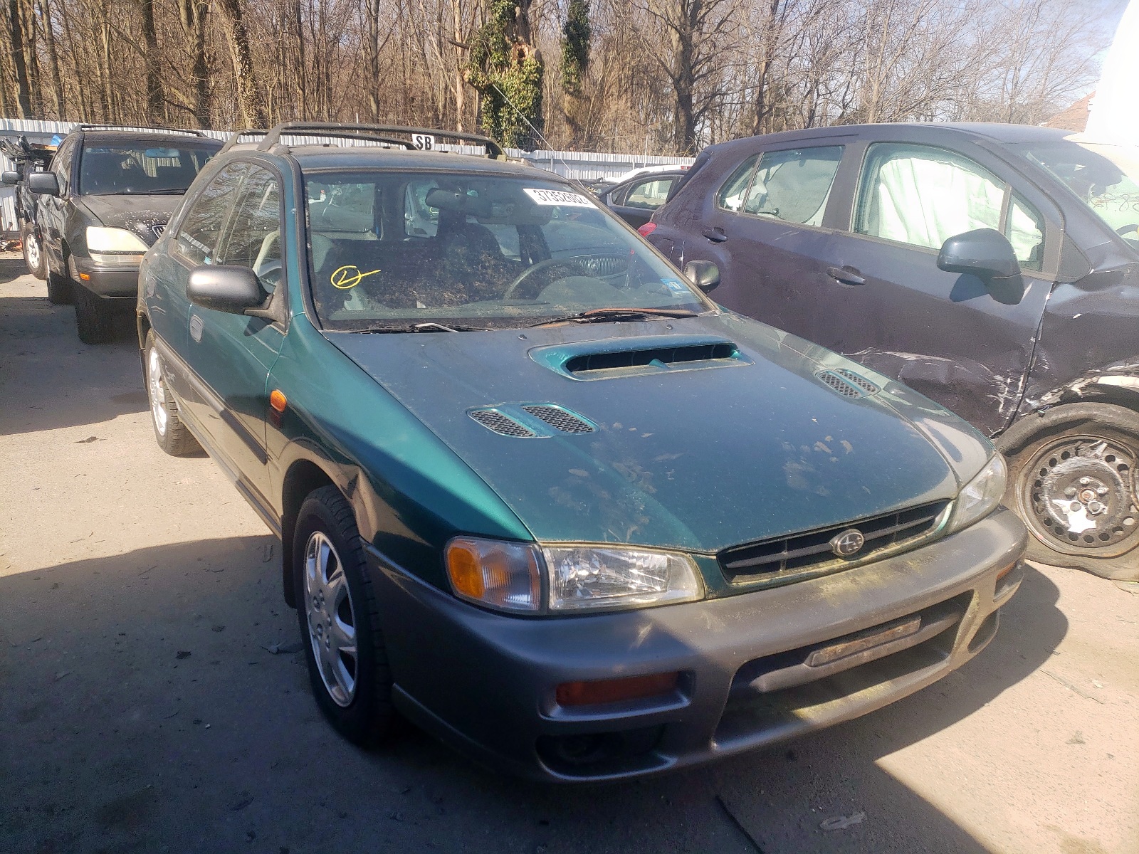 SUBARU IMPREZA OU 1999 with VIN JF1GF4856XH809315 - Photo from auction