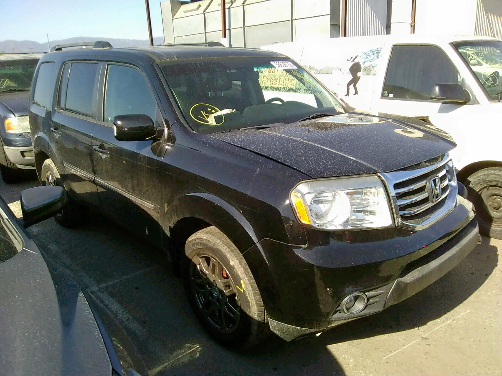 HONDA PILOT TOUR 2012 with VIN 5FNYF4H95CB077402 - Photo from auction