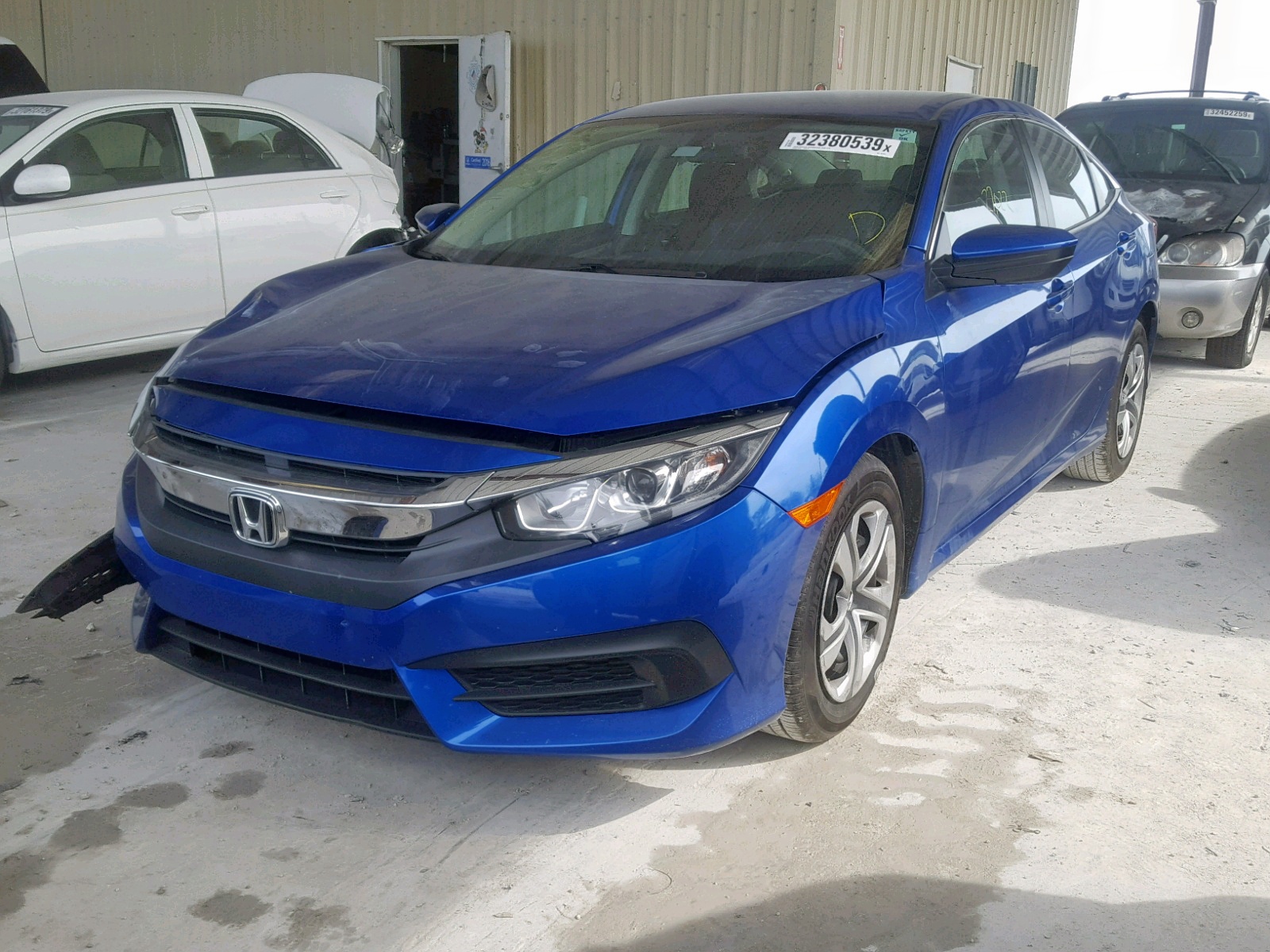 Photo 17 from auction – 2016 HONDA CIVIC LX with VIN 19XFC2F52GE021627