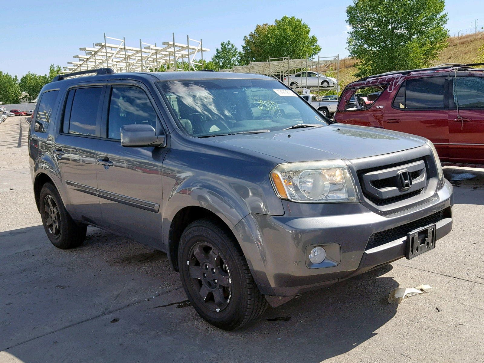 HONDA PILOT TOUR 2011 with VIN 5FNYF3H98BB015100 - Photo from auction