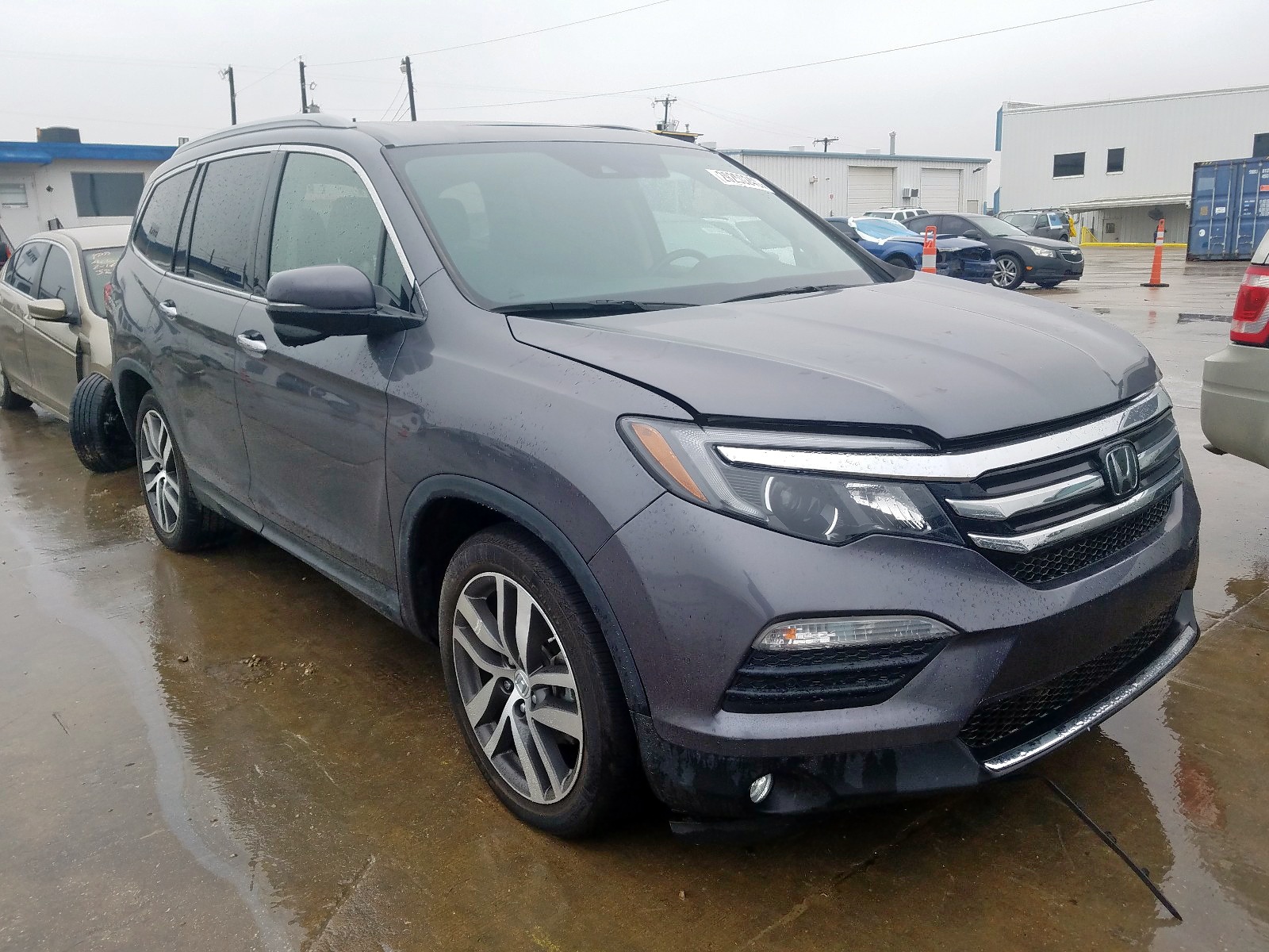 HONDA PILOT TOUR 2017 with VIN 5FNYF5H98HB001301 - Photo from auction