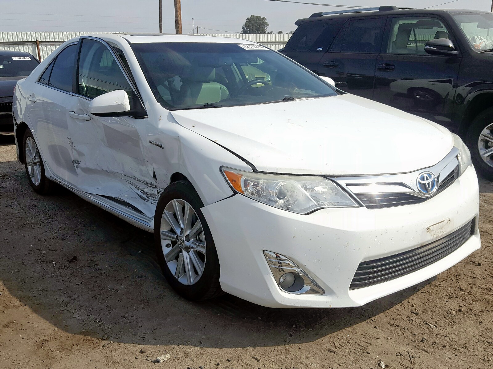 TOYOTA CAMRY HYBR 2014 with VIN 4T1BD1FK5EU112557 - Photo from auction