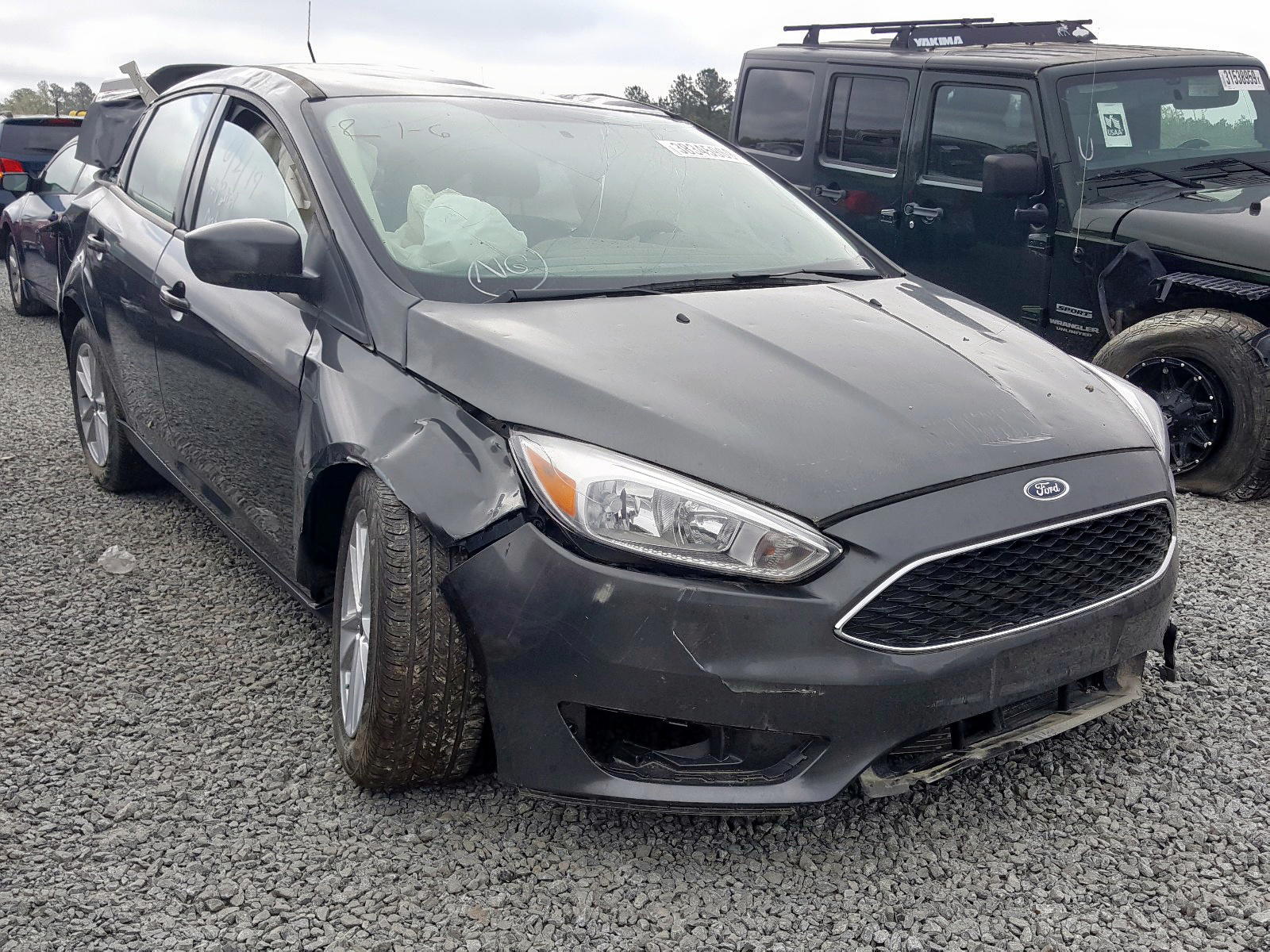 FORD FOCUS SE 2018 with VIN 1FADP3F25JL291348 - Photo from auction