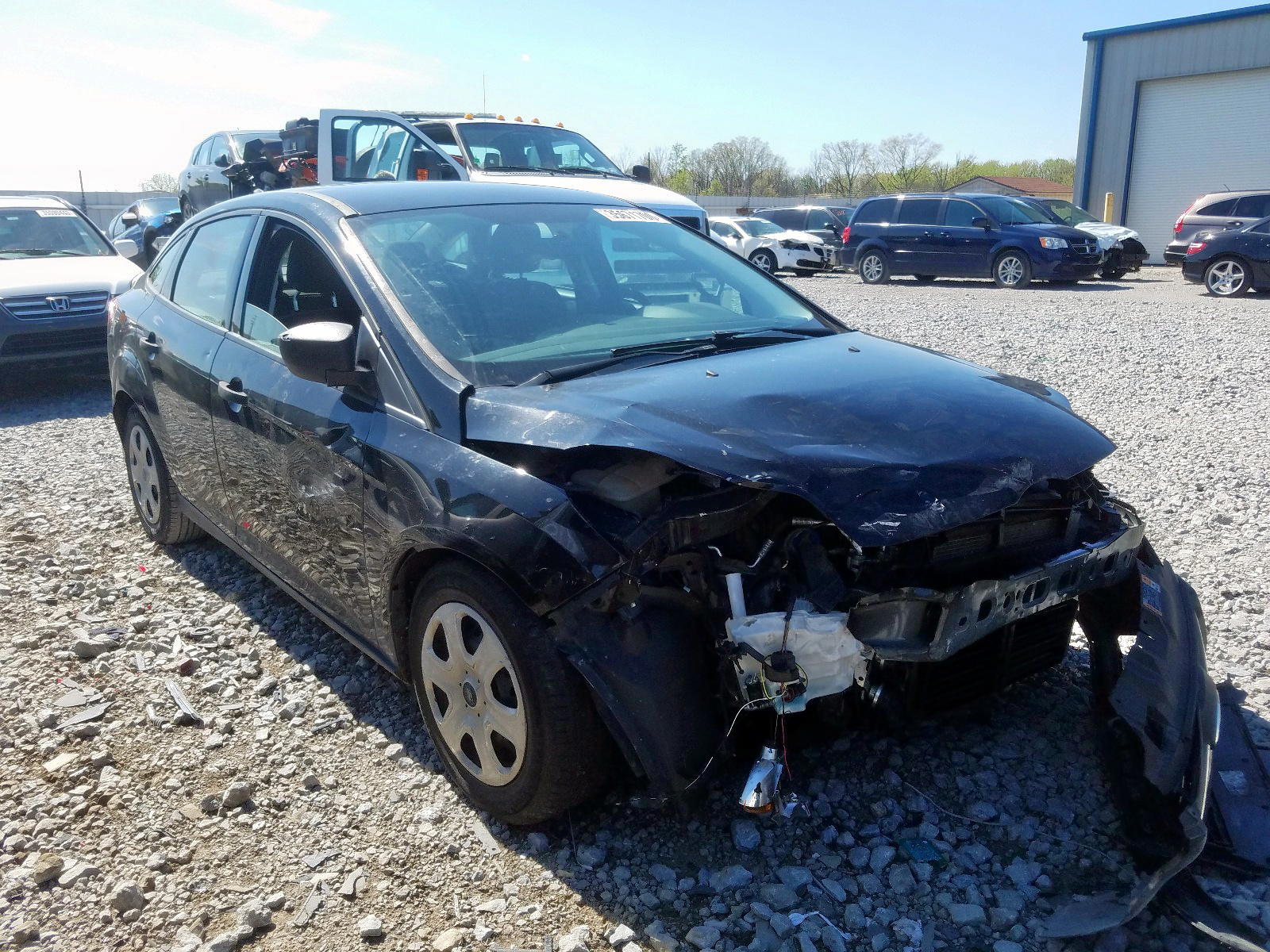 FORD FOCUS S 2014 with VIN 1FADP3E21EL419611 - Photo from auction