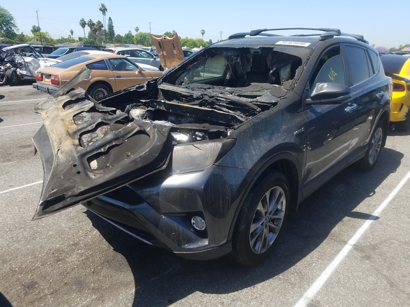 Photo 2 from auction – 2018 TOYOTA RAV4 HV LI with VIN JTMDJREV0JD249237