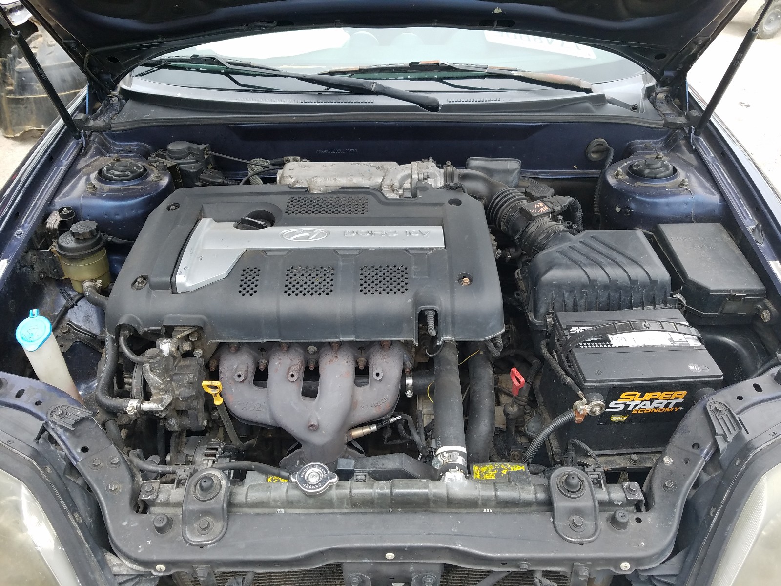 Photo 7 from auction – 2005 HYUNDAI TIBURON with VIN KMHHM65D85U170530