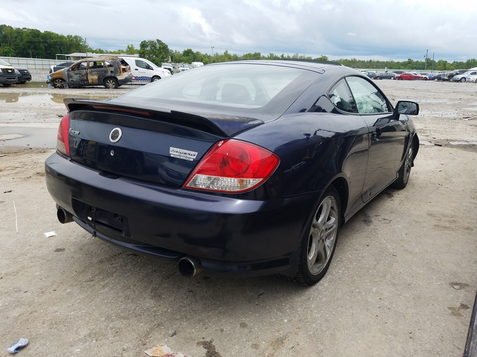 Photo 4 from auction – 2005 HYUNDAI TIBURON with VIN KMHHM65D85U170530