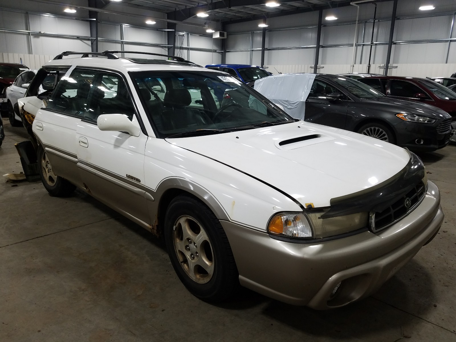 SUBARU LEGACY 1998 with VIN 4S3BG6857W7636888 - Photo from auction