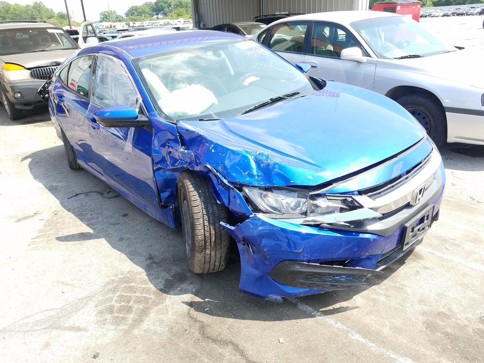HONDA CIVIC LX 2018 with VIN 19XFC2F56JE020519 - Photo from auction