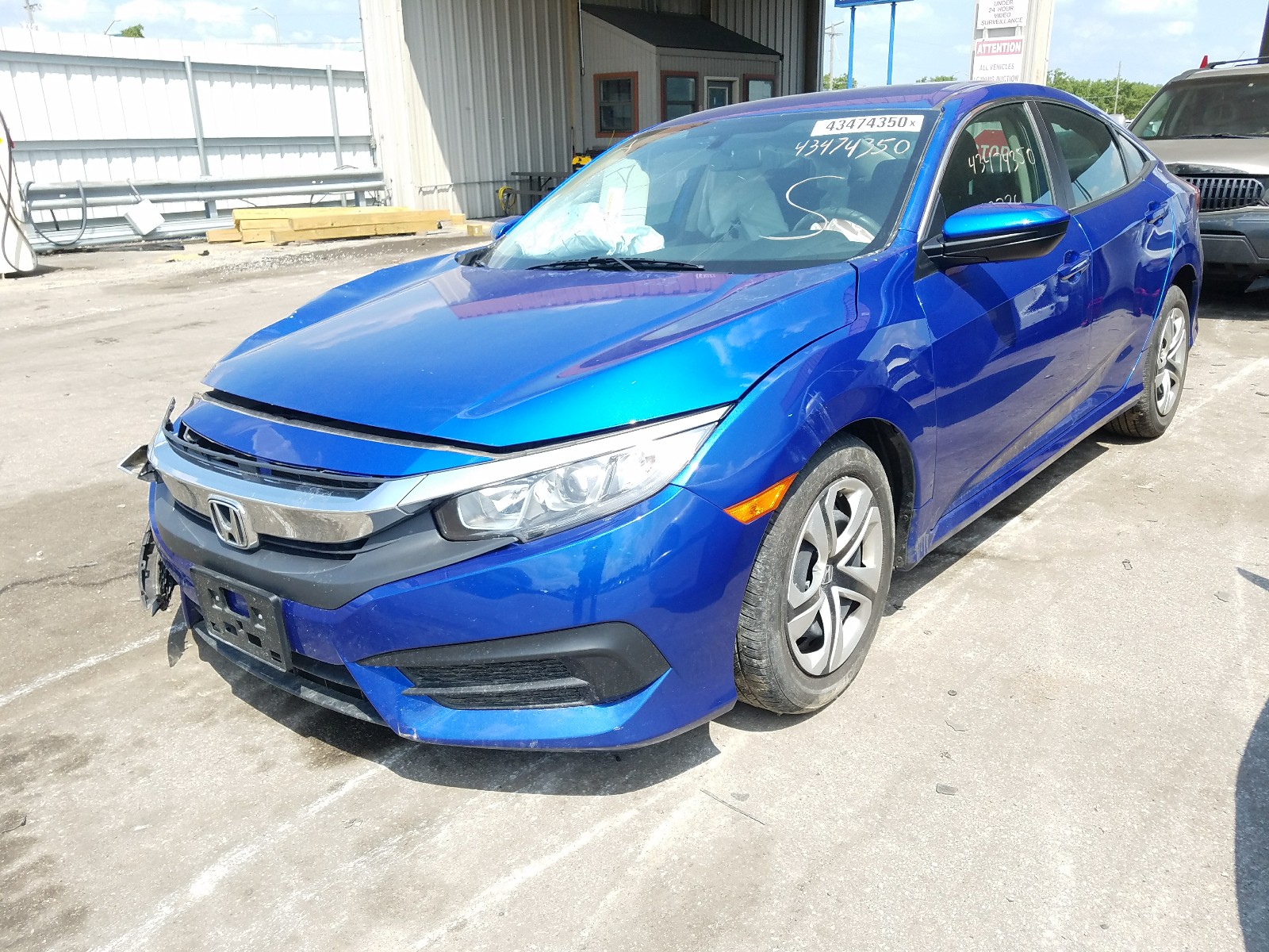 Photo 2 from auction – 2018 HONDA CIVIC LX with VIN 19XFC2F56JE020519