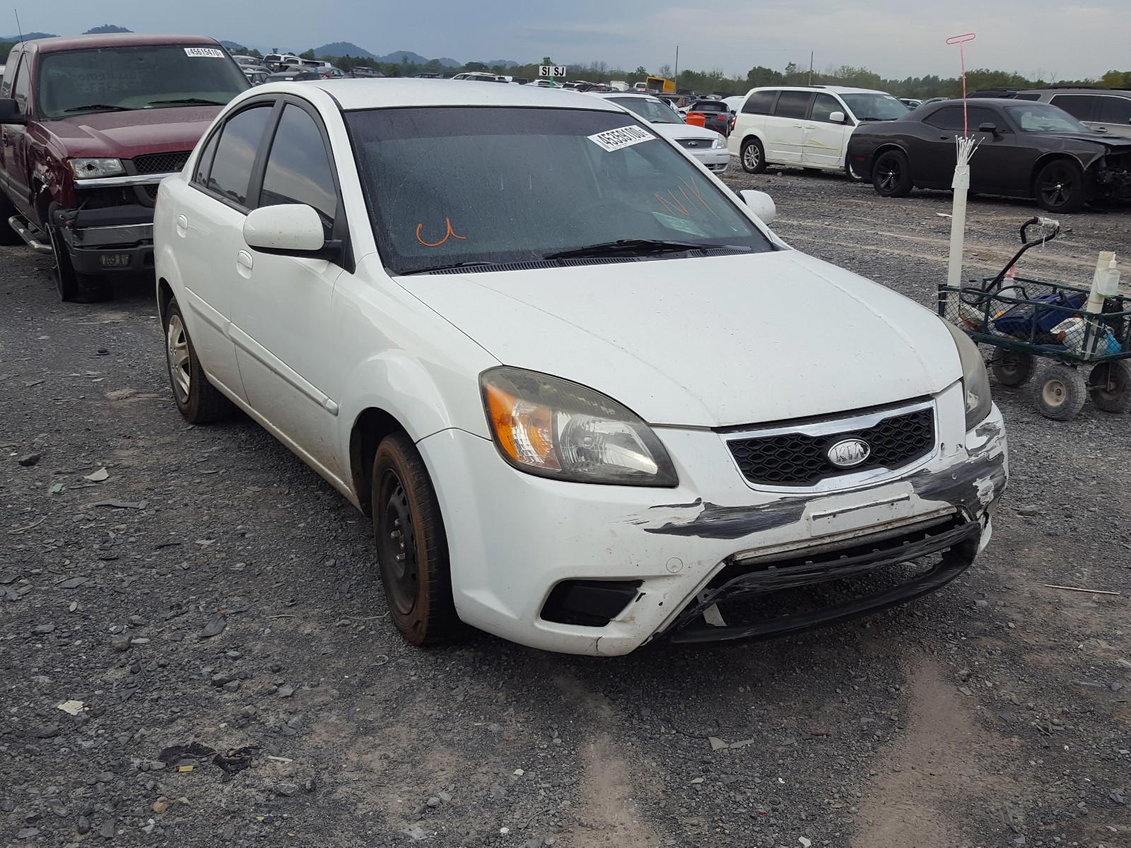 KIA RIO LX 2010 with VIN KNADH4A35A6624172 - Photo from auction