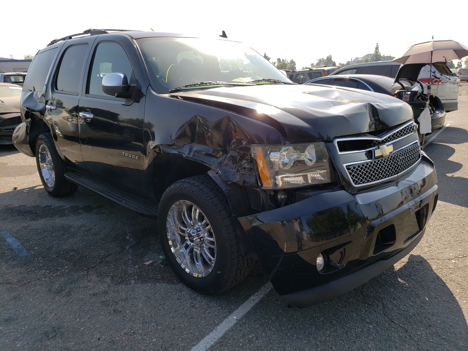 CHEVROLET TAHOE C150 2011 with VIN 1GNSCBE08BR135799 - Photo from auction